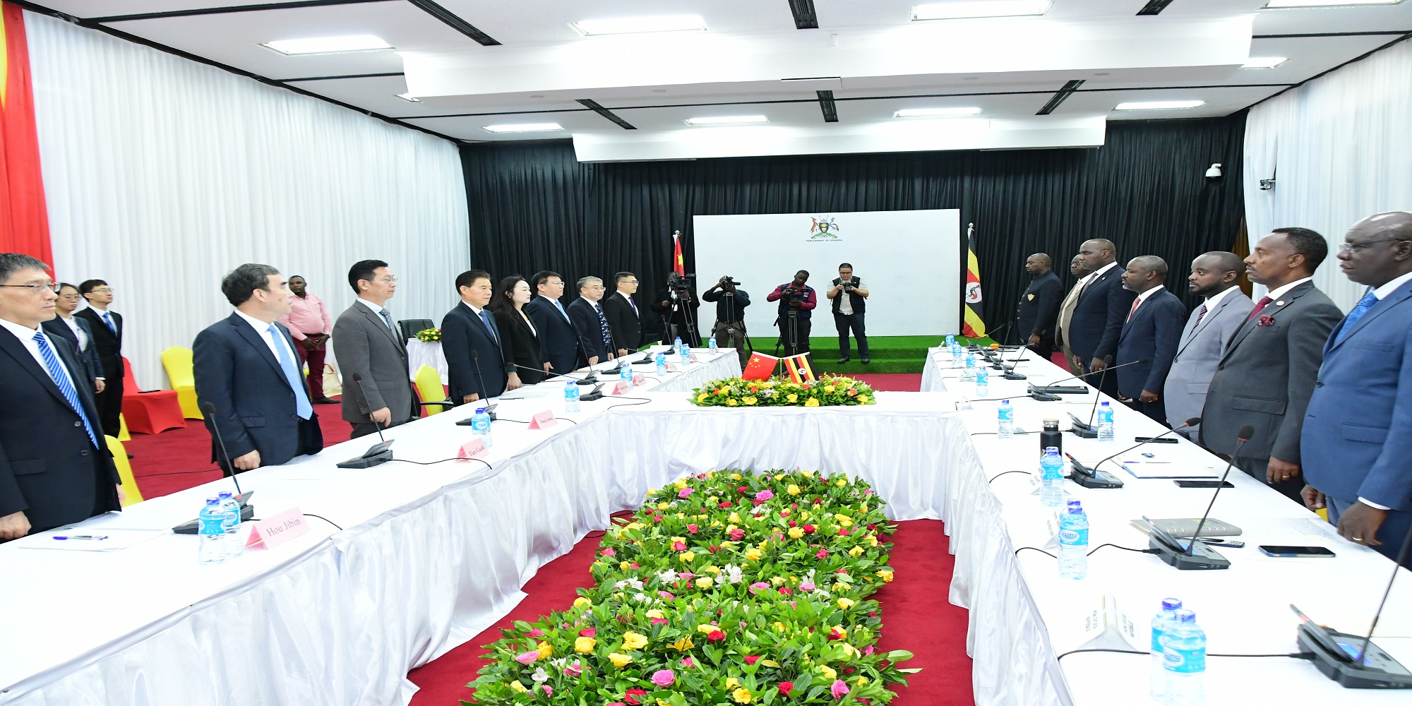 The Chinese and Ugandan parties settling down for the talks 