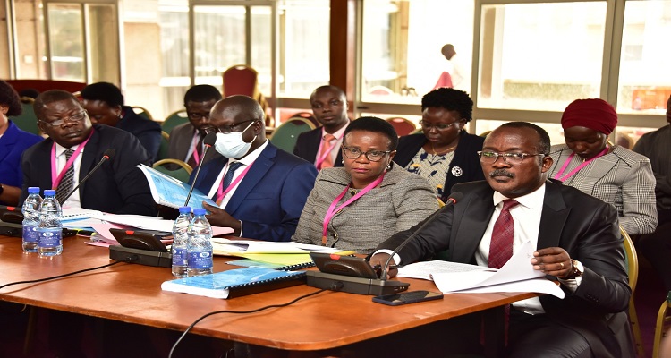 NWSC boss, Silver Mugisha accompanied by his staff before the committee